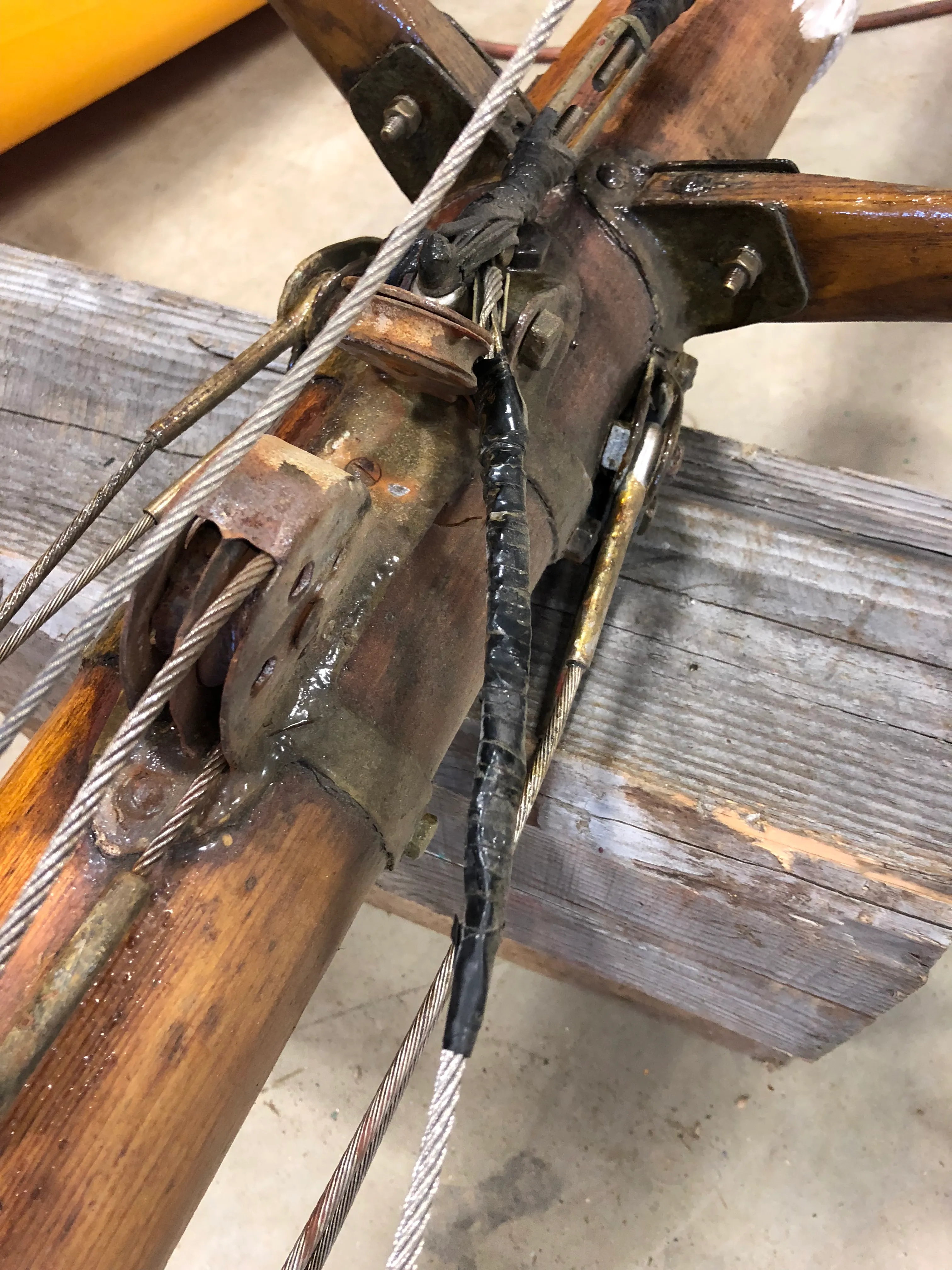 Close-up of old mast hardware showing wear and deterioration
