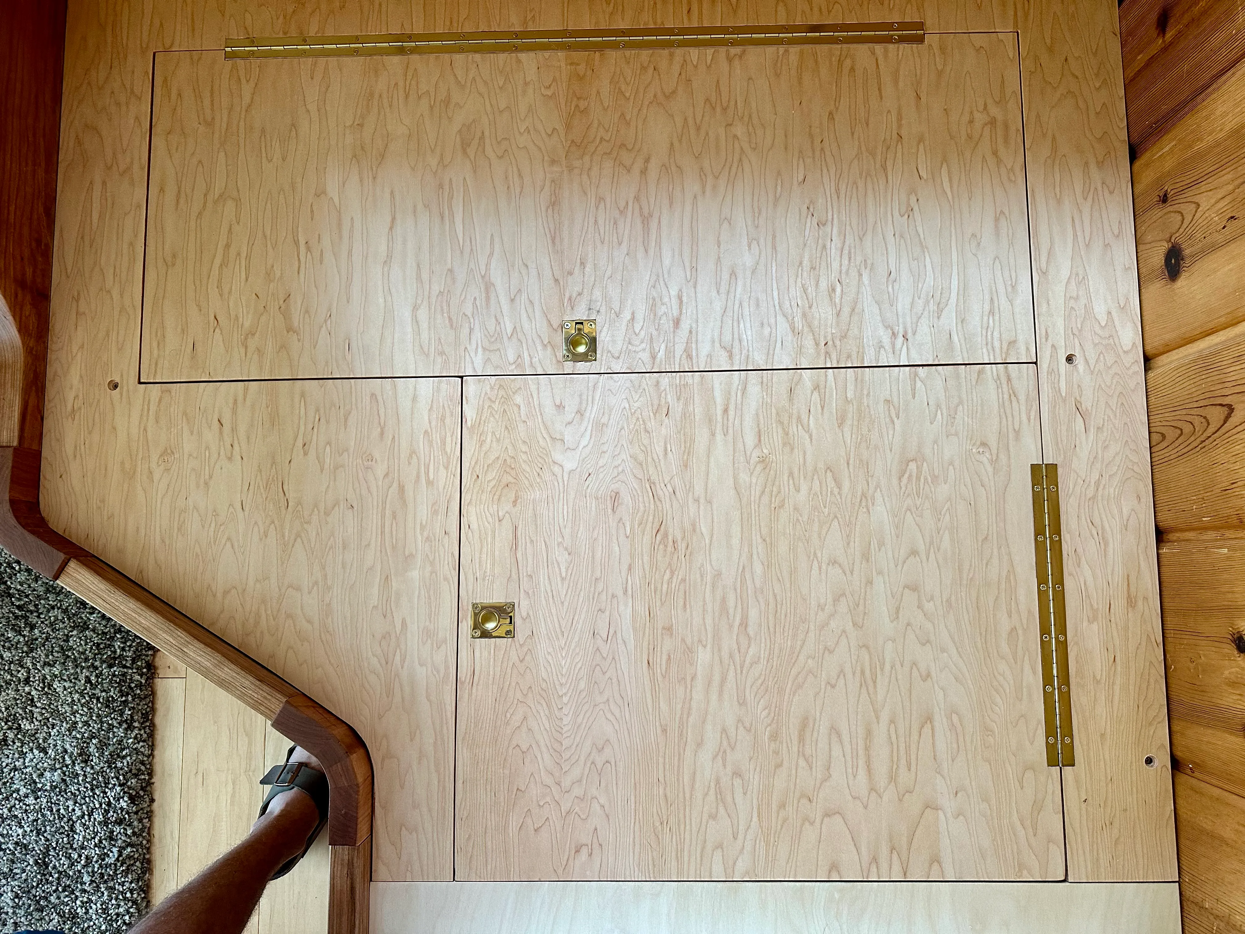 Hinged seat access panel with brass hardware