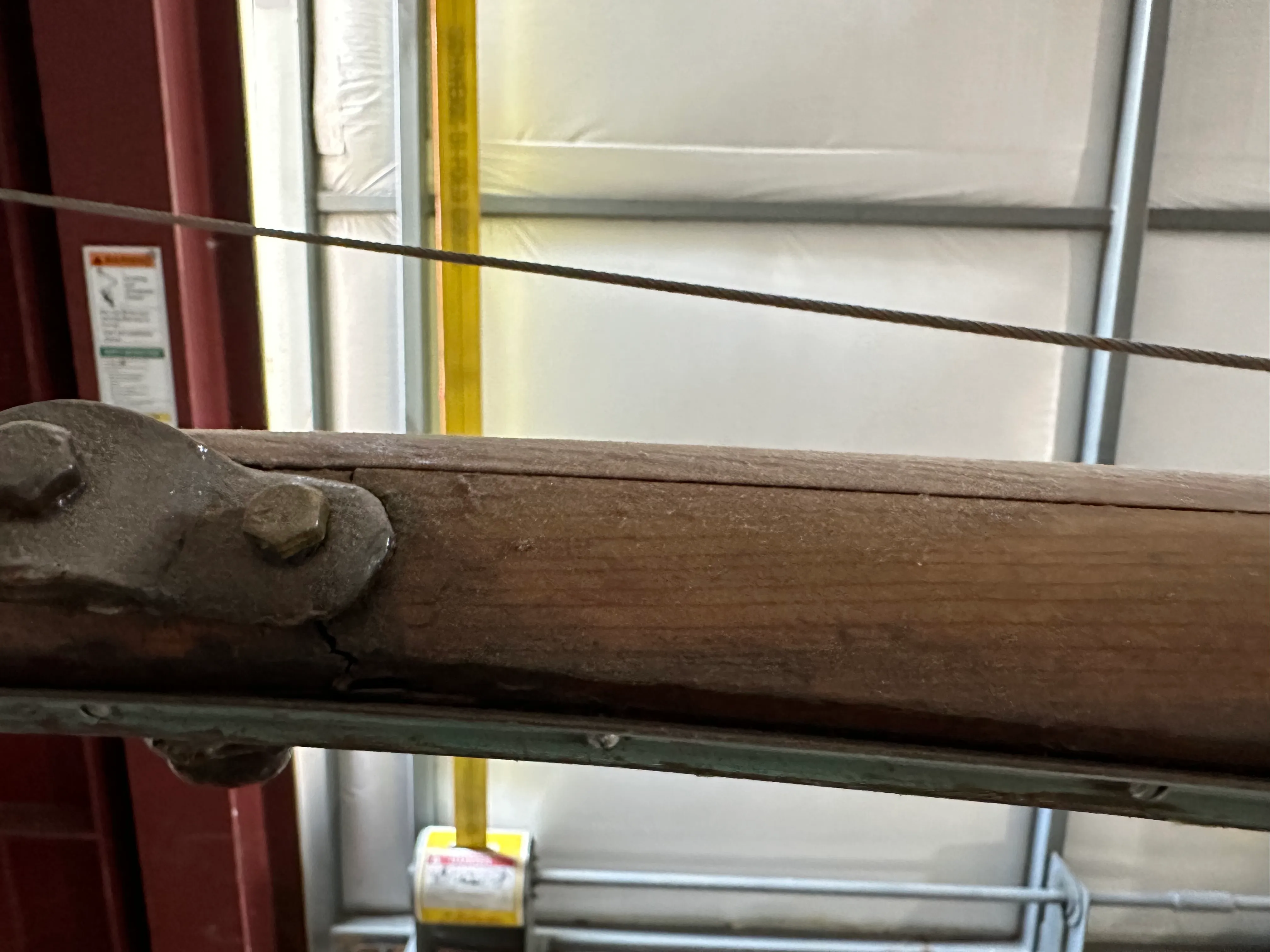 Old mast showing bronze fitting and longitudinal split