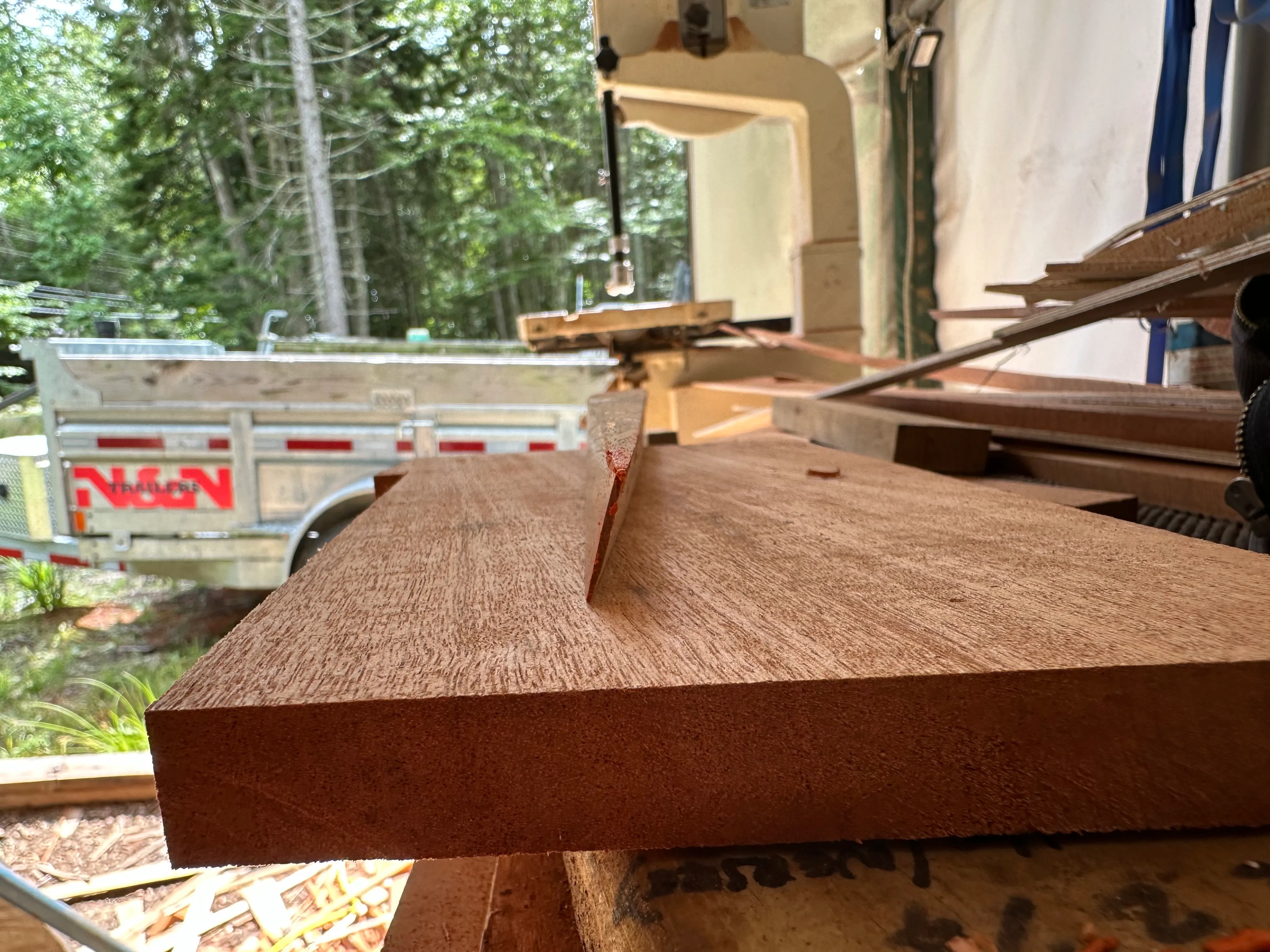 End of a plank on the bandsaw showing twist cut into the stock