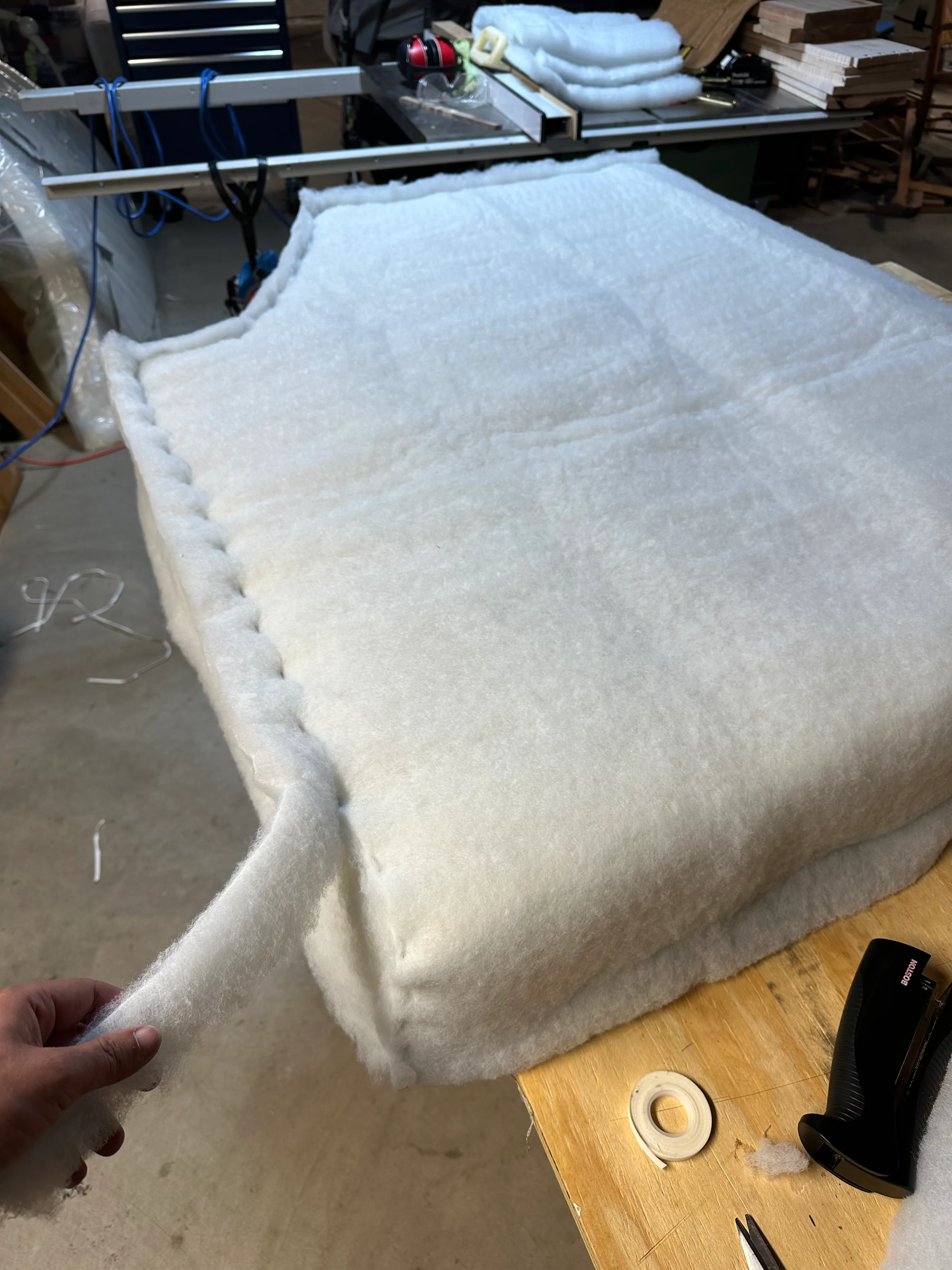 Finished cushion on bench with cat