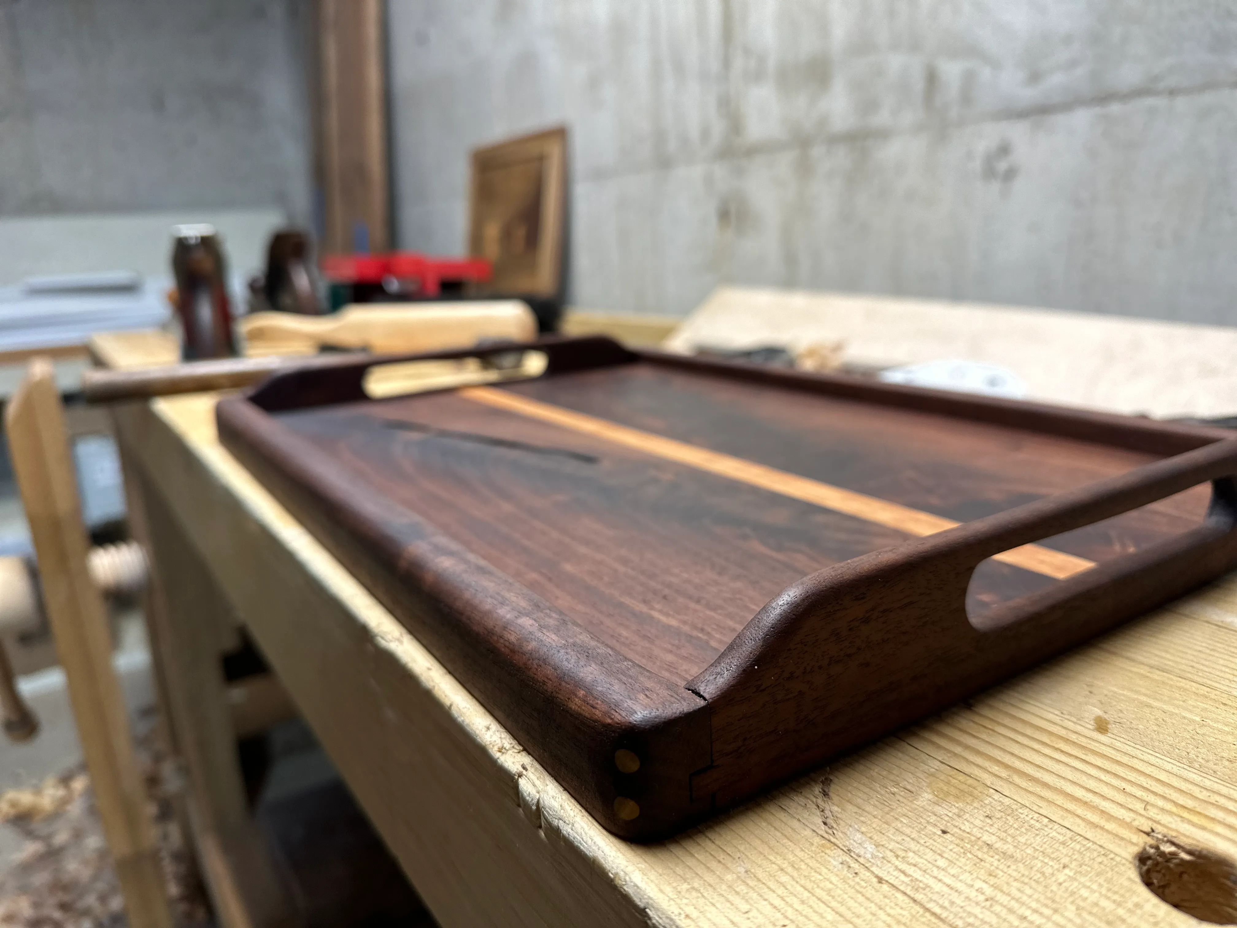 Low angle view of the tray showing corner spline detail and routed handle cutout