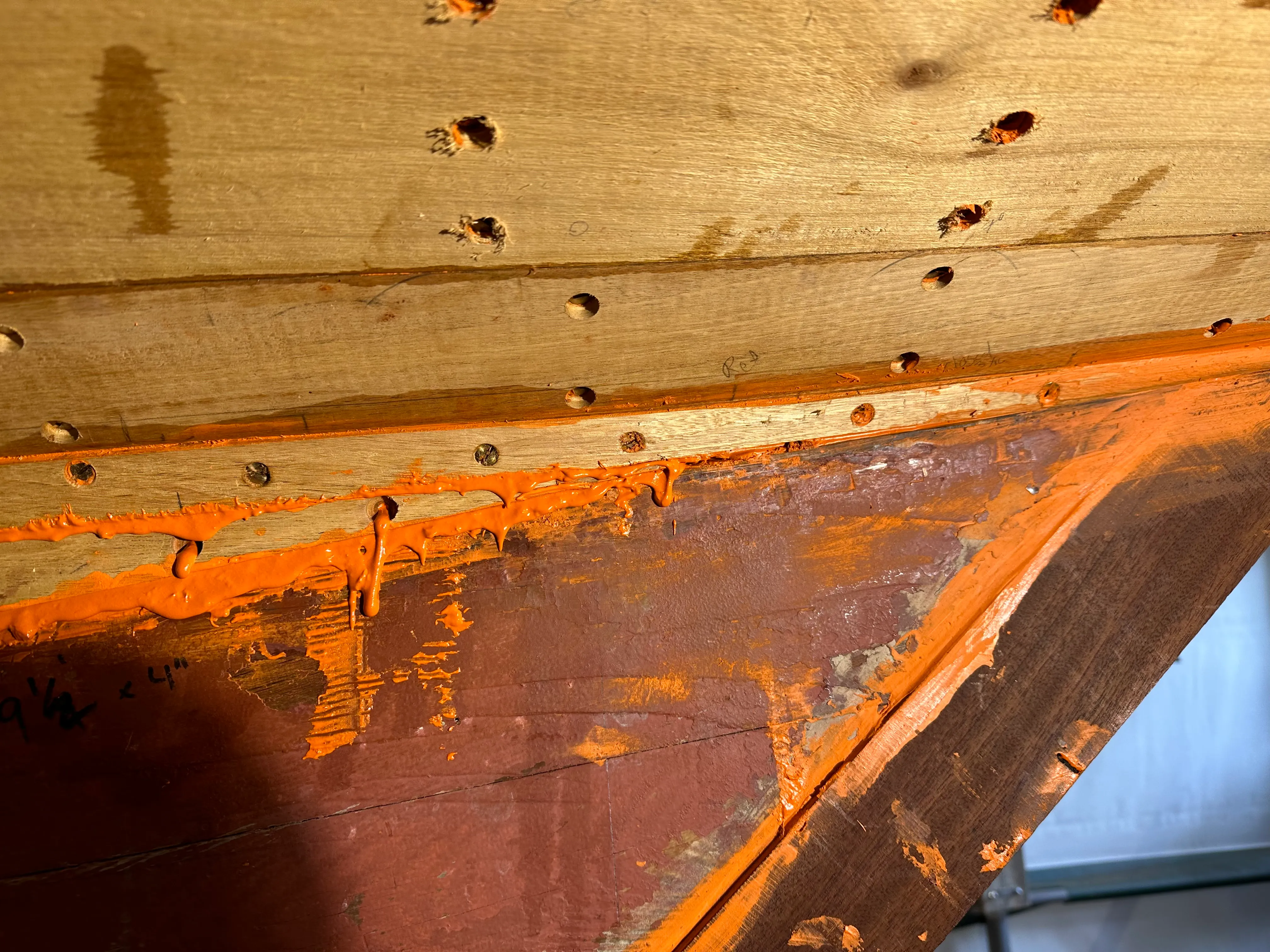 Twisted plank installed at the stern with red lead and Dolfinite visible