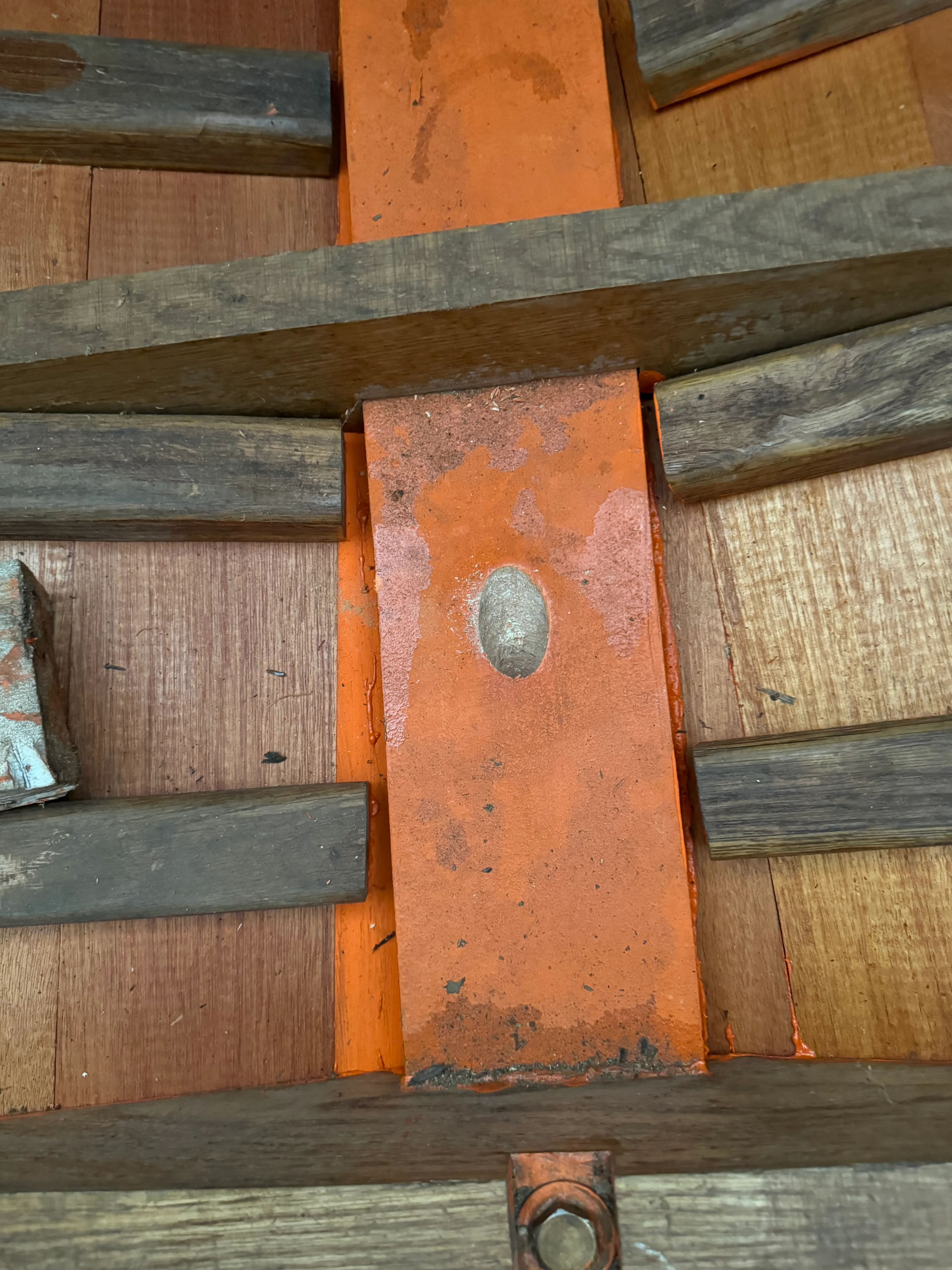 View from inside the boat looking down at the rudder post strap through the frames