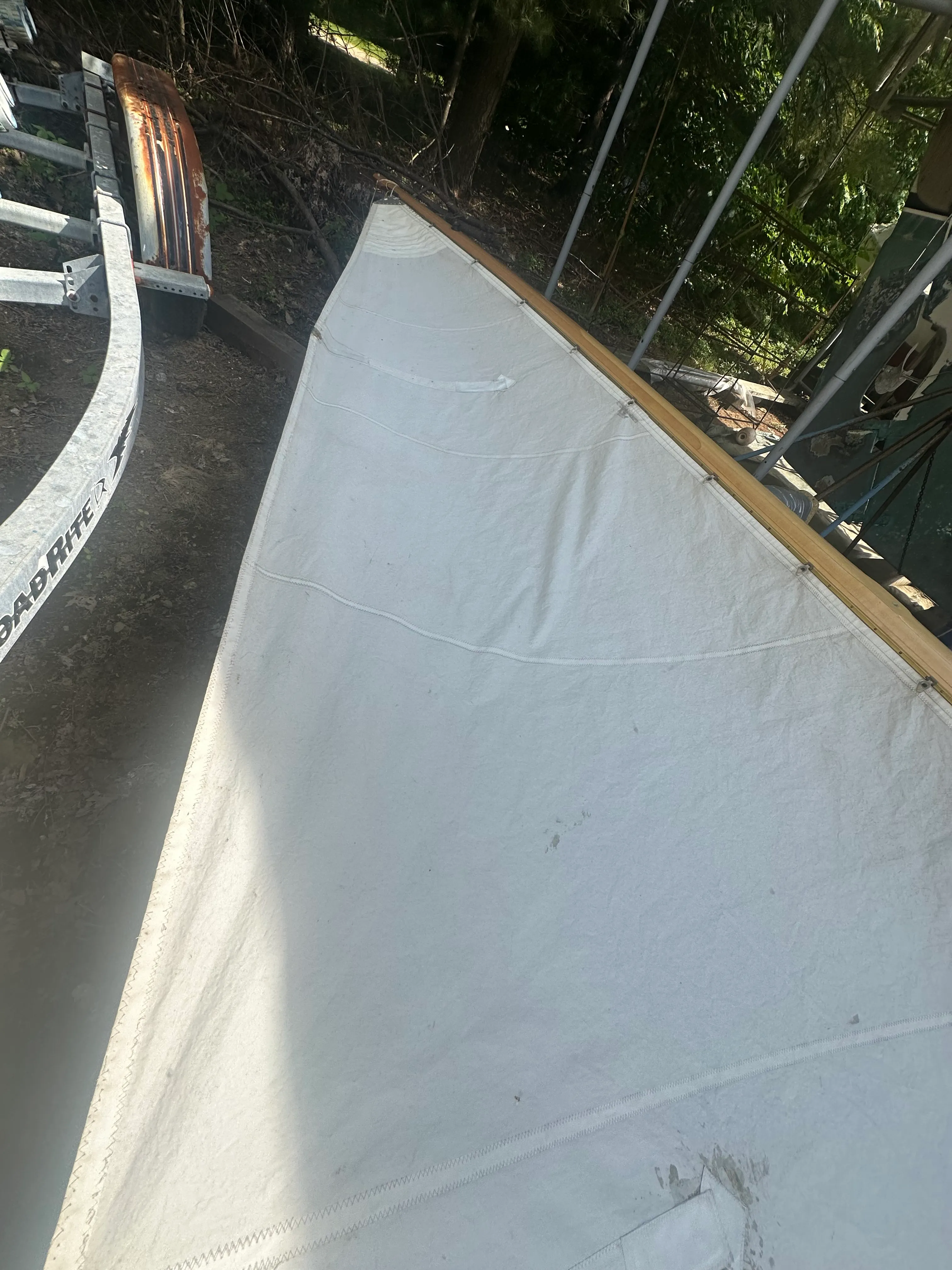 Close-up of mainsail hoisted on new mast