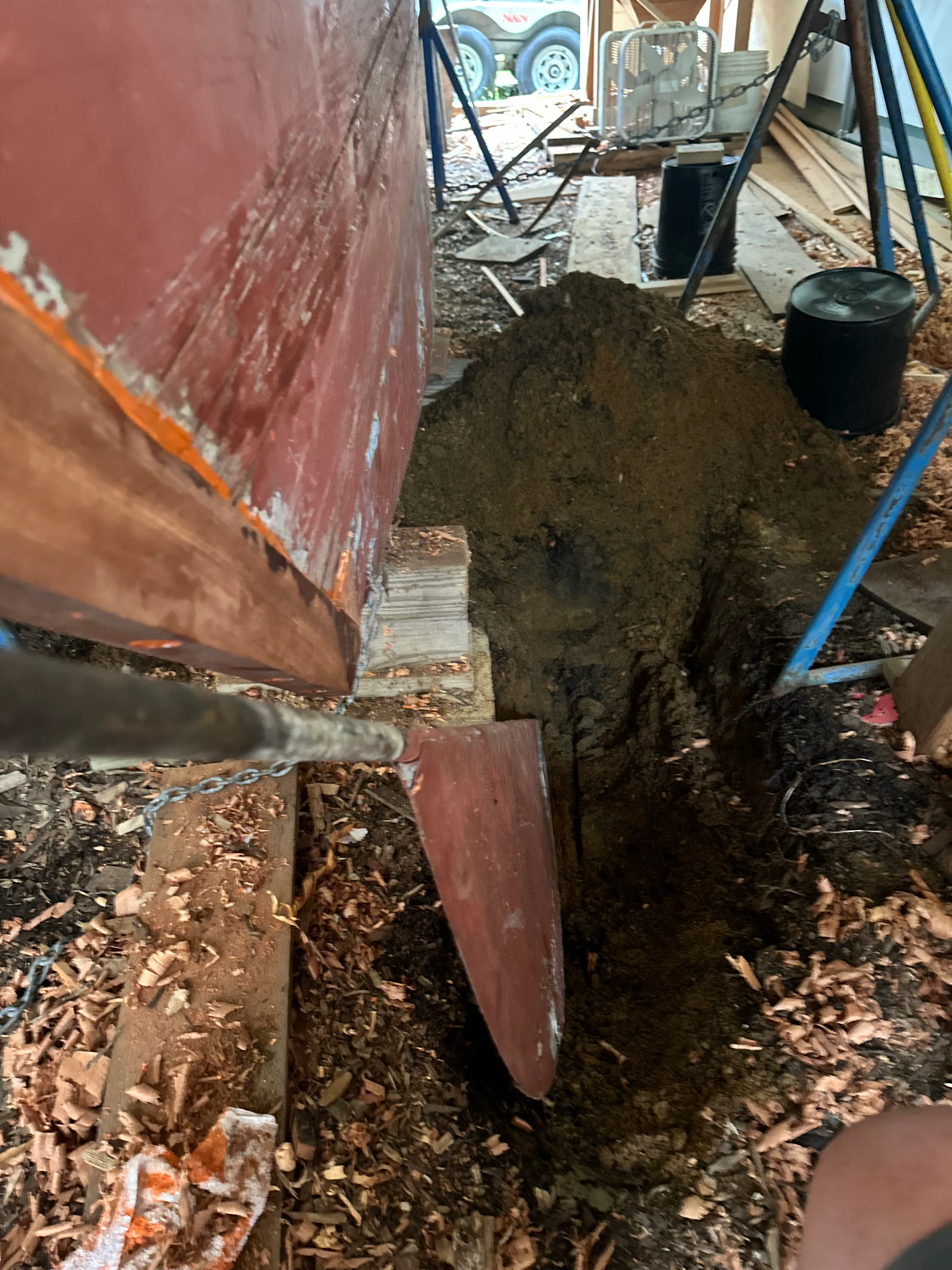 Hole dug beneath the stern of the boat with the rudder dropping down into it