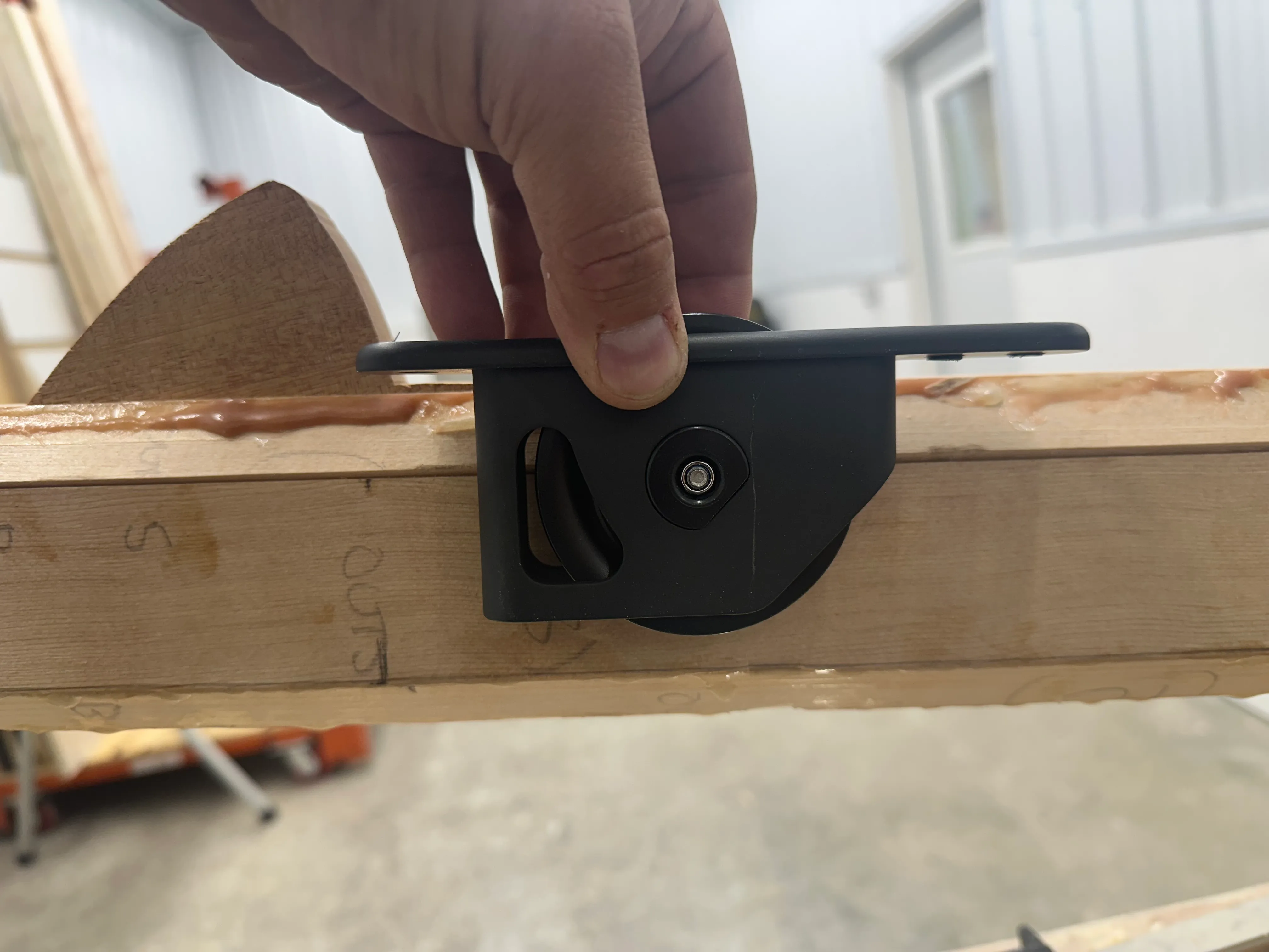 Halyard exit box being fitted into mast slot