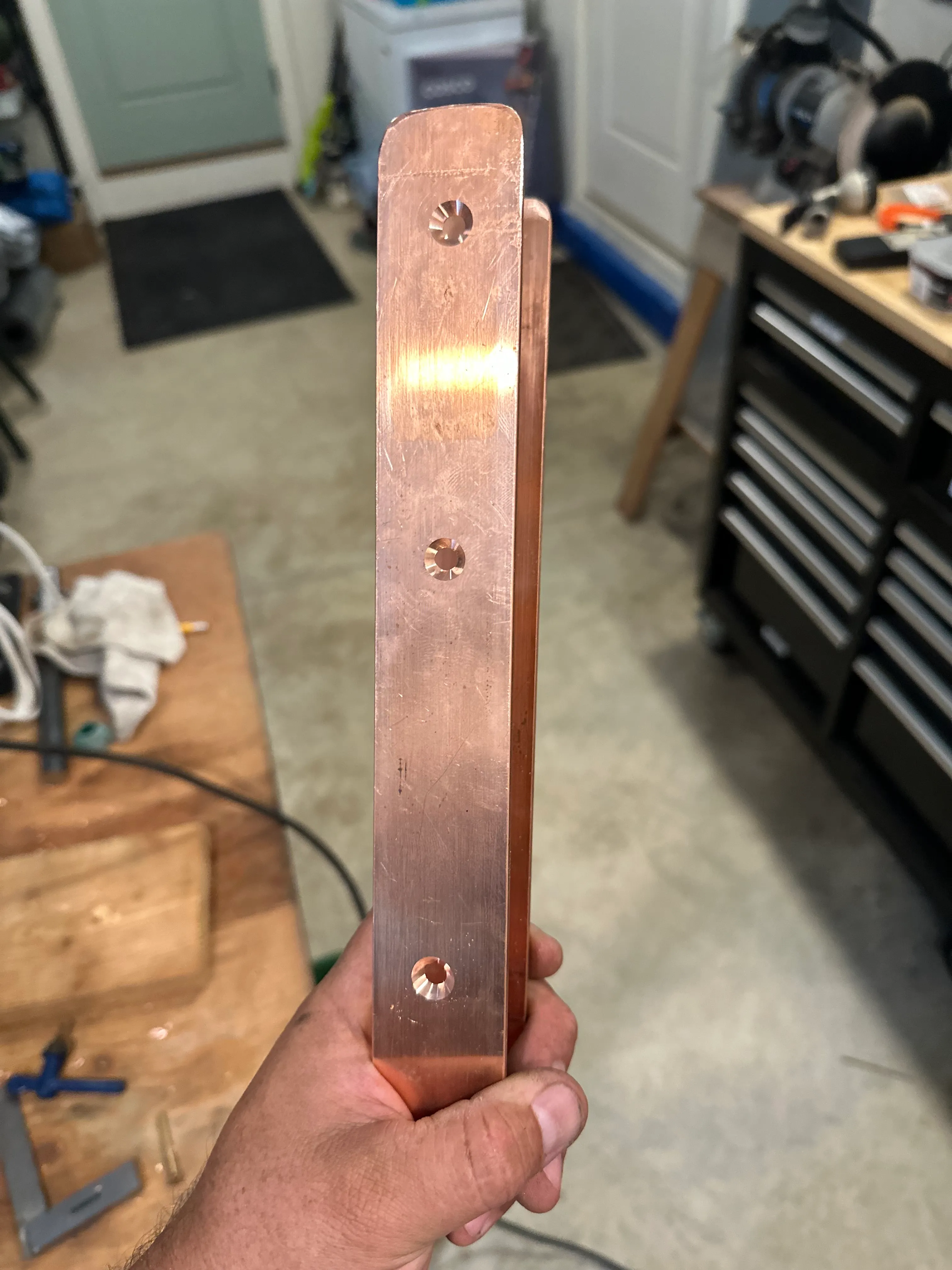 Finished copper strap with countersunk screw holes