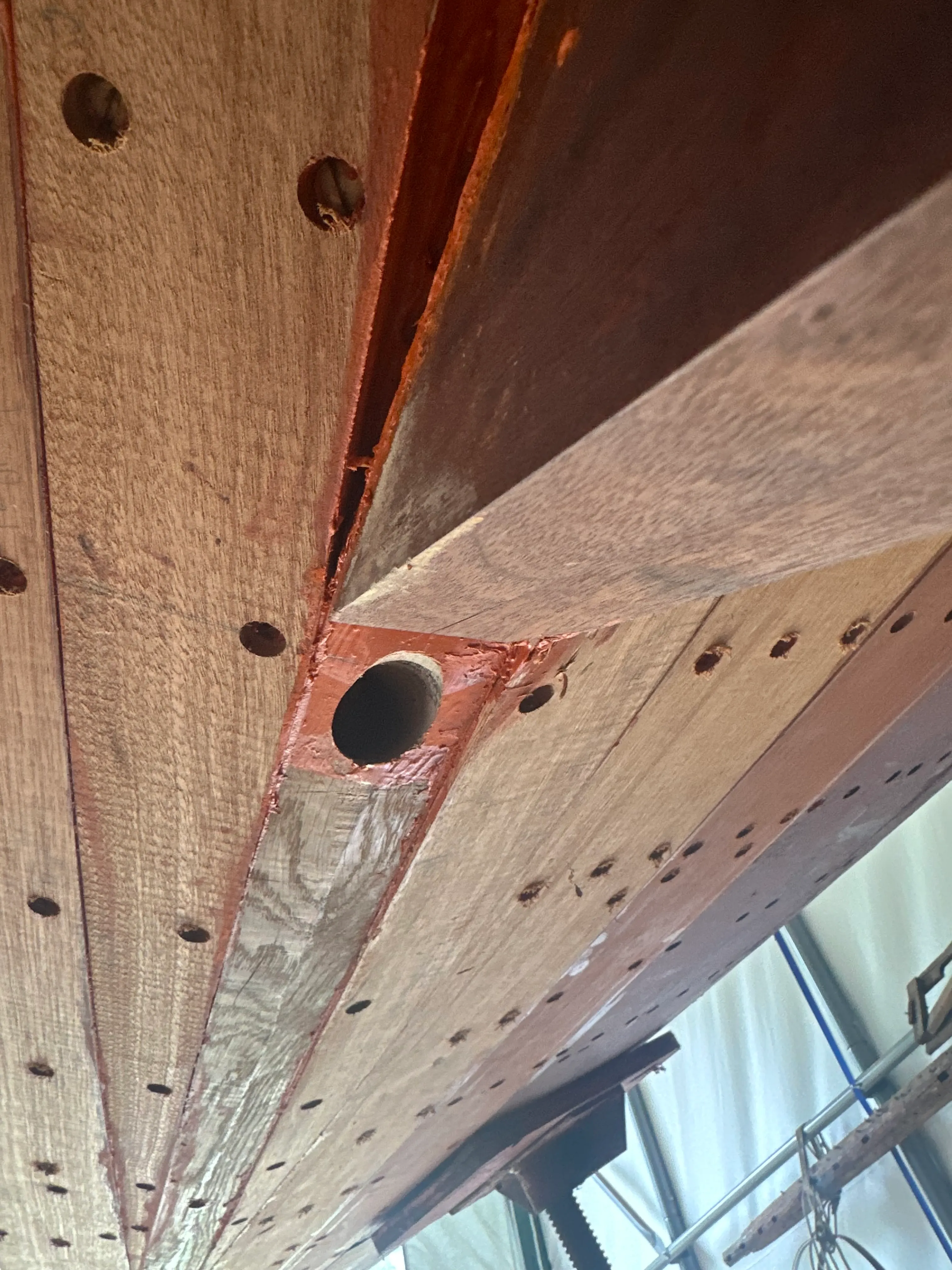 View from below the hull showing the drilled rudder port hole through the sternpost
