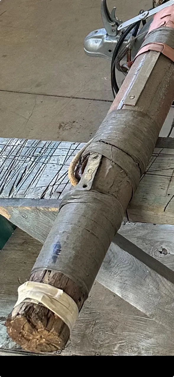 Close-up of the old mast's splintered butt end